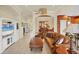 Inviting living room with neutral decor, tile flooring, and ample natural light at 1620 San Silvestro Dr, Venice, FL 34285