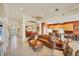 Open-concept living area with seamless flow to dining and kitchen spaces at 1620 San Silvestro Dr, Venice, FL 34285