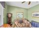 Inviting living room with floral couch, grandfather clock, and serene artwork at 1620 San Silvestro Dr, Venice, FL 34285