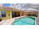 Beautiful pool with a screened enclosure and patio area for outdoor enjoyment at 1620 San Silvestro Dr, Venice, FL 34285