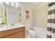 Bathroom featuring a vanity sink, decorative accents, and a tub/shower combo at 20370 Grazie Pl, Venice, FL 34293