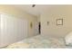 Comfortable bedroom with a closet and an adjacent hallway at 20370 Grazie Pl, Venice, FL 34293
