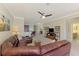 Cozy dining room with natural light, comfortable seating, and decorative lighting fixture at 20370 Grazie Pl, Venice, FL 34293