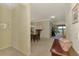 Spacious foyer leading to dining and living area with views of waterfront beyond at 20370 Grazie Pl, Venice, FL 34293