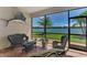 Waterfront lanai with brick floors, outdoor seating and panoramic views of the lake at 20370 Grazie Pl, Venice, FL 34293