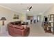 Open concept living area showcases kitchen bar and comfortable leather seating arrangement at 20370 Grazie Pl, Venice, FL 34293