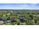 Aerial view showcasing neighborhood and condo building in the distance at 2185 Park Rd, Venice, FL 34293