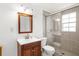 Bathroom with a modern vanity, toilet, and a walk-in shower with glass doors at 2185 Park Rd, Venice, FL 34293
