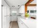 Bright kitchen with white cabinets, white countertops, and stainless steel appliances at 2185 Park Rd, Venice, FL 34293