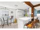 Cozy kitchen with a breakfast bar, white counters, and great natural light at 2185 Park Rd, Venice, FL 34293