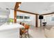 Open floor plan with a breakfast bar and view of the living space with exposed beams at 2185 Park Rd, Venice, FL 34293