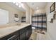 Well-appointed bathroom featuring a spacious vanity and a shower with tiled walls at 23527 Awabuki # 202, Venice, FL 34293