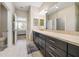 Well-appointed bathroom featuring a walk-in shower, vanity with lots of storage, and neutral wall colors at 23527 Awabuki # 202, Venice, FL 34293