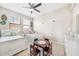Bright bedroom with twin beds, a table with chairs, and neutral decor at 23527 Awabuki # 202, Venice, FL 34293
