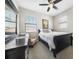 Serene bedroom with ample natural light, comfortable bed, and modern furnishings at 23527 Awabuki # 202, Venice, FL 34293