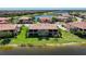 Beautiful condo overlooking a serene lake, lush landscaping, and picturesque scenery at 23527 Awabuki # 202, Venice, FL 34293