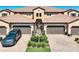 This home features a paver driveway, 2-car garage and lush landscaping at 23527 Awabuki # 202, Venice, FL 34293