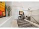 Bright hallway leading to living area with stylish decor and neutral color palette at 23527 Awabuki # 202, Venice, FL 34293