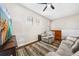 Cozy living room with plush seating, television, and natural light from the windows at 23527 Awabuki # 202, Venice, FL 34293