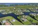 Stunning aerial view of waterfront homes on canals surrounded by green landscaping at 24339 Matias Ln, Punta Gorda, FL 33955