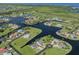 Aerial view of waterfront homes and canals creating a scenic neighborhood at 24339 Matias Ln, Punta Gorda, FL 33955