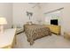 Comfortable bedroom featuring a tropical theme, desk, television, and ceiling fan at 24339 Matias Ln, Punta Gorda, FL 33955