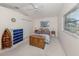 Cozy bedroom with nautical-themed decor, natural light, and ample closet space at 24339 Matias Ln, Punta Gorda, FL 33955
