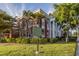 Stately historic building featuring red brick facade, grand columns, and manicured lawn at 24339 Matias Ln, Punta Gorda, FL 33955