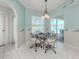 Eat in kitchen/dining area with view of pool through sliding glass doors at 24339 Matias Ln, Punta Gorda, FL 33955