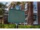 Historical marker sign with a nearby brick building and palm trees at 24339 Matias Ln, Punta Gorda, FL 33955