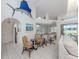 Open floor plan with wet bar, tile floors, and view of the elevated ceilings at 24339 Matias Ln, Punta Gorda, FL 33955