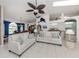 Spacious living room featuring neutral tones, white tile flooring, and an open-concept design with high ceilings at 24339 Matias Ln, Punta Gorda, FL 33955