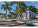Charming street view featuring colorful buildings and manicured landscaping at 24339 Matias Ln, Punta Gorda, FL 33955