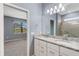 Bright bathroom featuring double sinks, granite countertop, and separate shower room at 2487 Marton Oak Blvd, North Port, FL 34289