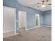 Spacious bedroom with walk-in closet and en-suite bathroom entrances at 2487 Marton Oak Blvd, North Port, FL 34289