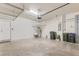 Spacious garage featuring an automatic door, water heater, utility sink, and ample storage space at 2487 Marton Oak Blvd, North Port, FL 34289