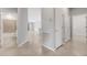 Hallway featuring tile flooring and views to multiple rooms at 2487 Marton Oak Blvd, North Port, FL 34289