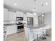 Well-lit kitchen with stainless steel appliances and a breakfast bar at 2487 Marton Oak Blvd, North Port, FL 34289