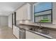 Kitchen view showcasing stainless steel appliances, modern countertops and ample cabinet space at 2487 Marton Oak Blvd, North Port, FL 34289