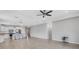 Spacious living room with tile flooring connecting to the kitchen and dining area at 2487 Marton Oak Blvd, North Port, FL 34289