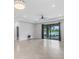 Spacious living area with tile floors and sliding glass doors leading to the lanai at 2487 Marton Oak Blvd, North Port, FL 34289