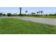 A sprawling backyard with a privacy fence and lush green grass at 26115 Rampart Blvd, Punta Gorda, FL 33983