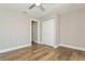 Light-filled bedroom with wood-look tile flooring and closet at 26115 Rampart Blvd, Punta Gorda, FL 33983