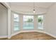 Dining area with large windows offering views of the pool at 26115 Rampart Blvd, Punta Gorda, FL 33983