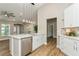Well-lit kitchen with stainless steel appliances, and wood-style flooring at 26115 Rampart Blvd, Punta Gorda, FL 33983