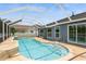 Inviting in-ground pool with a screened enclosure and convenient access from the house at 26115 Rampart Blvd, Punta Gorda, FL 33983