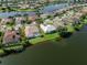 Home highlighted with a view of the screened-in pool and waterfront backyard at 2928 Seasons Blvd, Sarasota, FL 34240