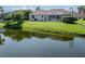 The residence has a screened-in pool with a view of the tranquil water at 2928 Seasons Blvd, Sarasota, FL 34240
