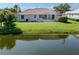 The residence has a screened-in pool with a view of the tranquil water at 2928 Seasons Blvd, Sarasota, FL 34240