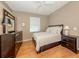 Bedroom features wood floor, area rug, neutral wall color, and window view at 2928 Seasons Blvd, Sarasota, FL 34240